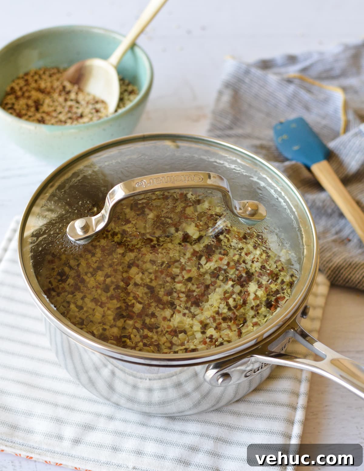 How to Cook Tri-Color Quinoa Perfectly Every Time 5 cooked quinoa in a saucepan with a lid