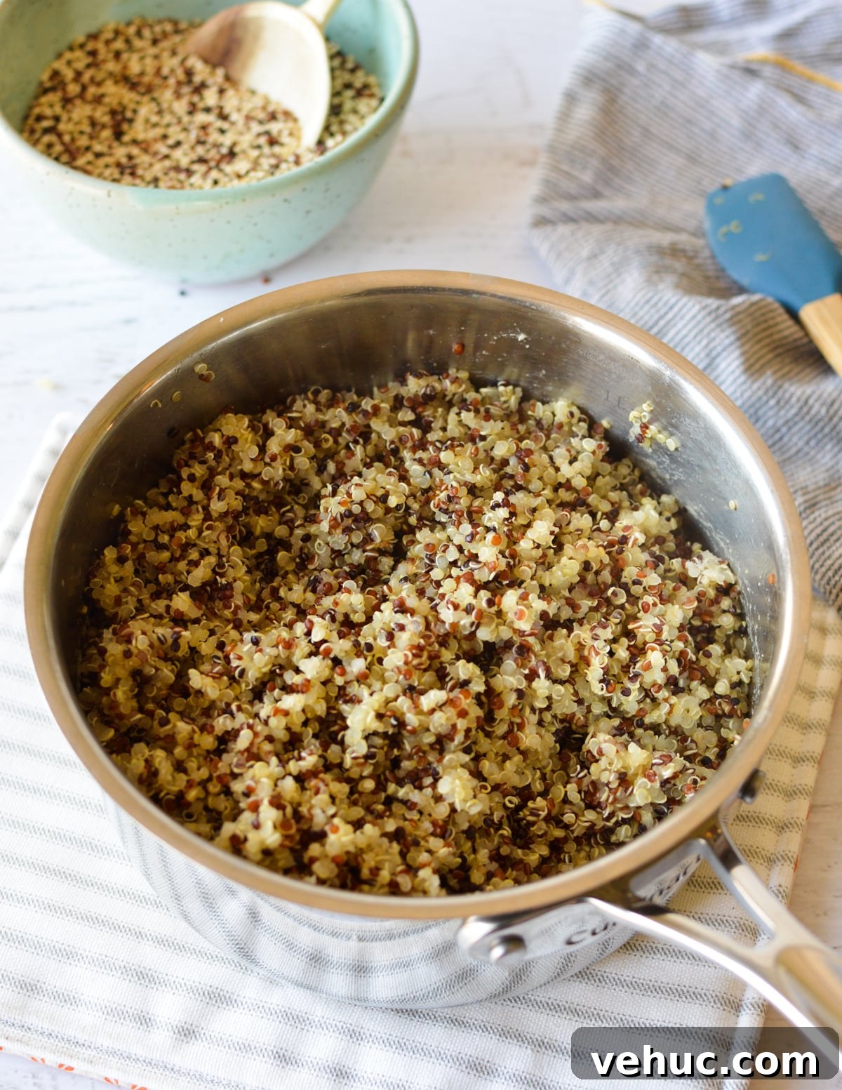 How to Cook Tri-Color Quinoa Perfectly Every Time 6 a saucepan full of cooked quinoa.