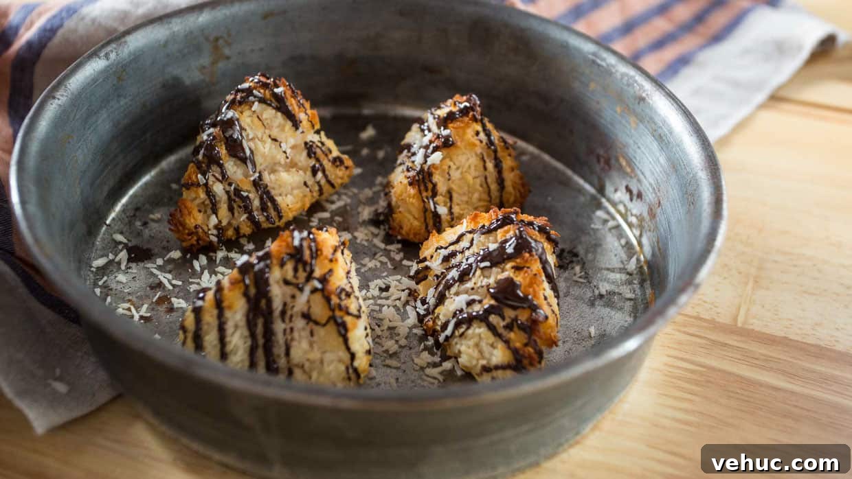 4 Coconut macaroons on baking dish.