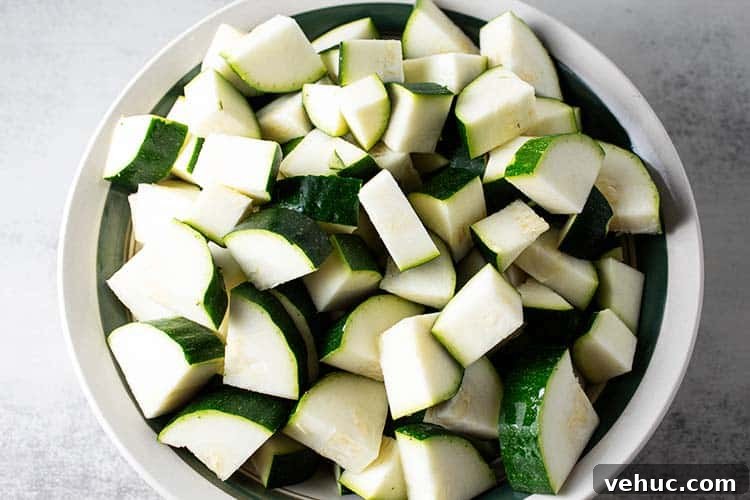 overhead view of bowl full of chopped zucchini
