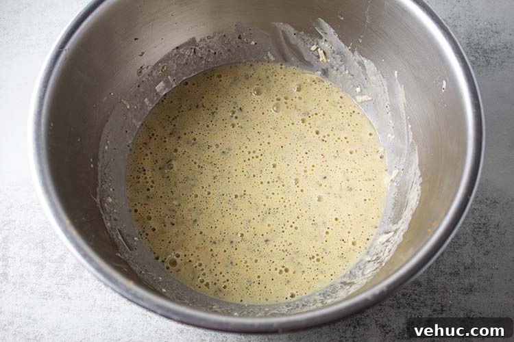 overhead view of egg mixture to be added to chicken and zucchini casserole
