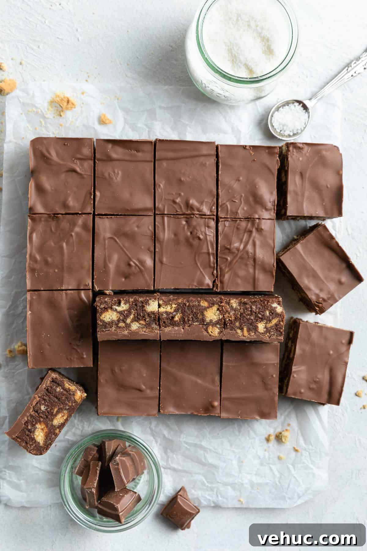 No-Bake Chocolate Hedgehog Slice Recipe: Quick Crowd-Pleaser 6 Overhead shot of slice cut into squares, sitting on some baking paper.