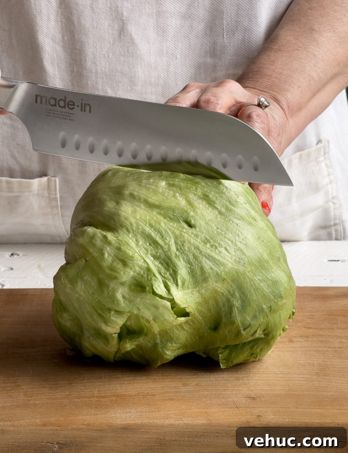 Summer Celebration Wedge Salad Recipe with Fresh Ingredients 3 cutting the iceberg