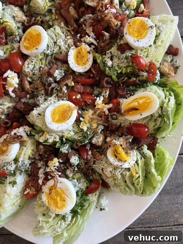 Summer Celebration Wedge Salad Recipe with Fresh Ingredients 7 A classic wedge salad with wedges of iceberg lettuce, hard boiled eggs, bacon, cherry tomato, blue cheese, and chives.