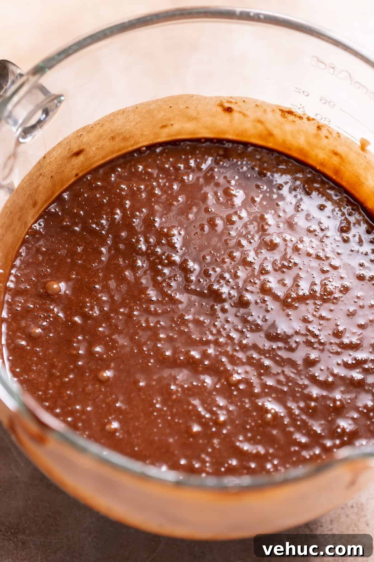 Moist Chocolate Cake Recipe That Tops Bakery Cakes 4 Smooth chocolate cake batter in a mixing bowl with a glossy, thick consistency.