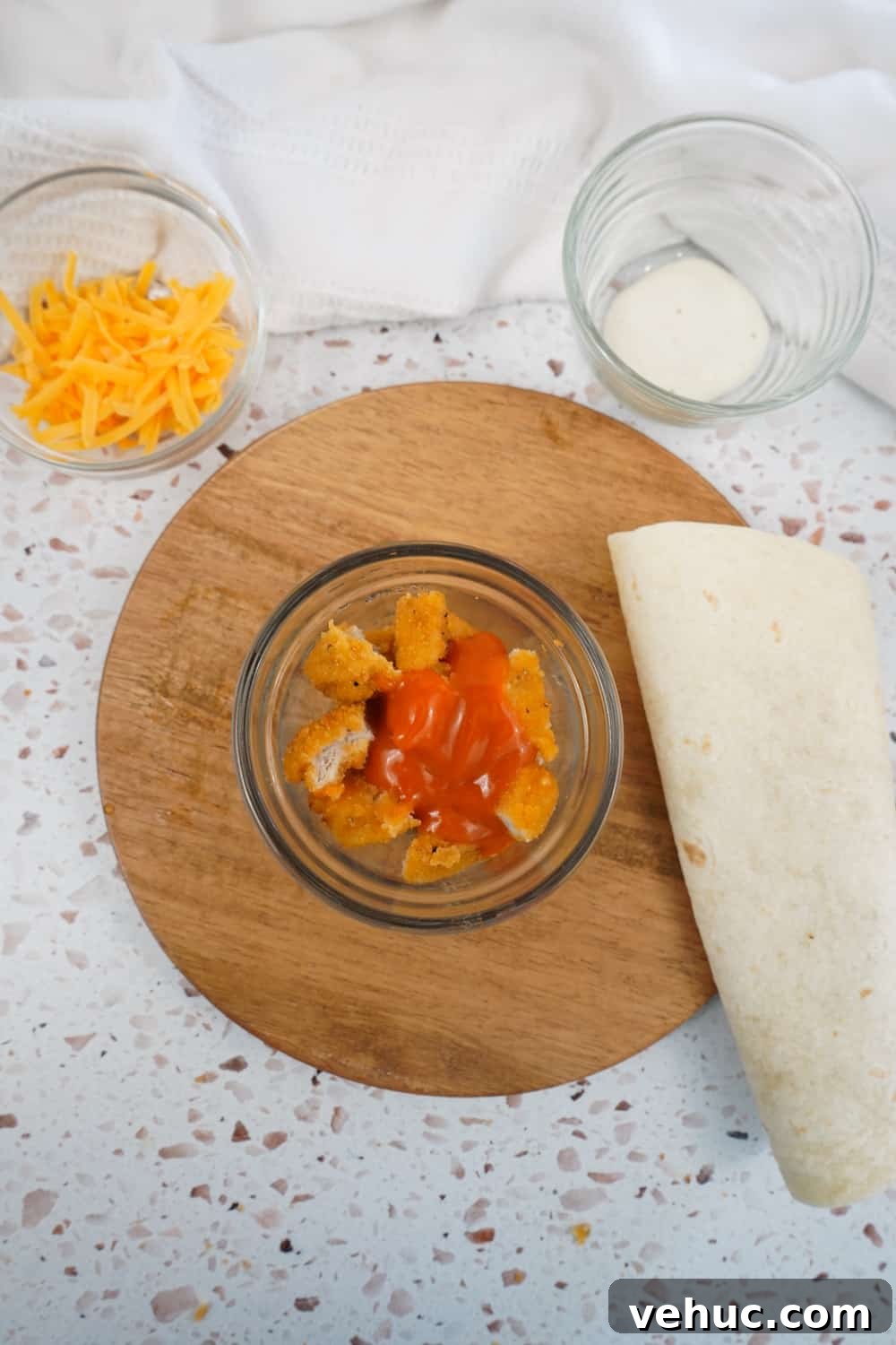 2-Minute Buffalo Chicken Nugget Wrap Recipe for Quick Lunch 2 Adding buffalo sauce to chicken nuggets