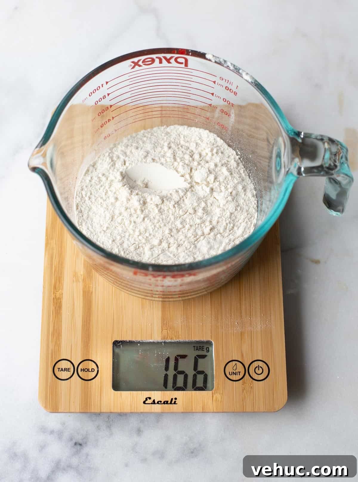 Restaurant-Style Single Pizza Dough Recipe for One 6 A digital scale measuring flour in a glass dish