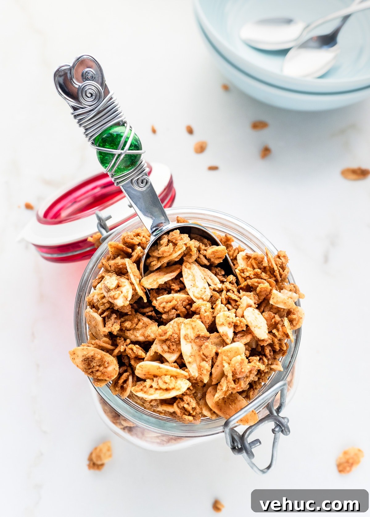 Crunchy Vanilla Almond Granola Recipe for Homemade Mornings 2 Top view of a mason jar filled with homemade vanilla almond granola.