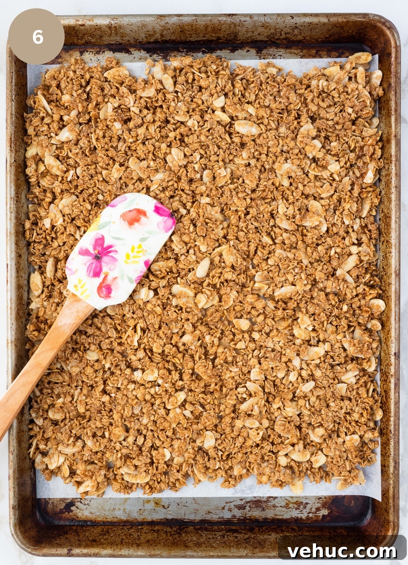 Crunchy Vanilla Almond Granola Recipe for Homemade Mornings 7 Baking sheet with almond granola spread out on it.