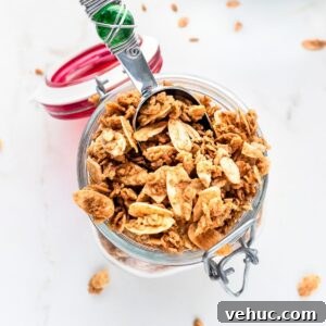 Crunchy Vanilla Almond Granola Recipe for Homemade Mornings 9 Mason jar filled with vanilla almond granola.