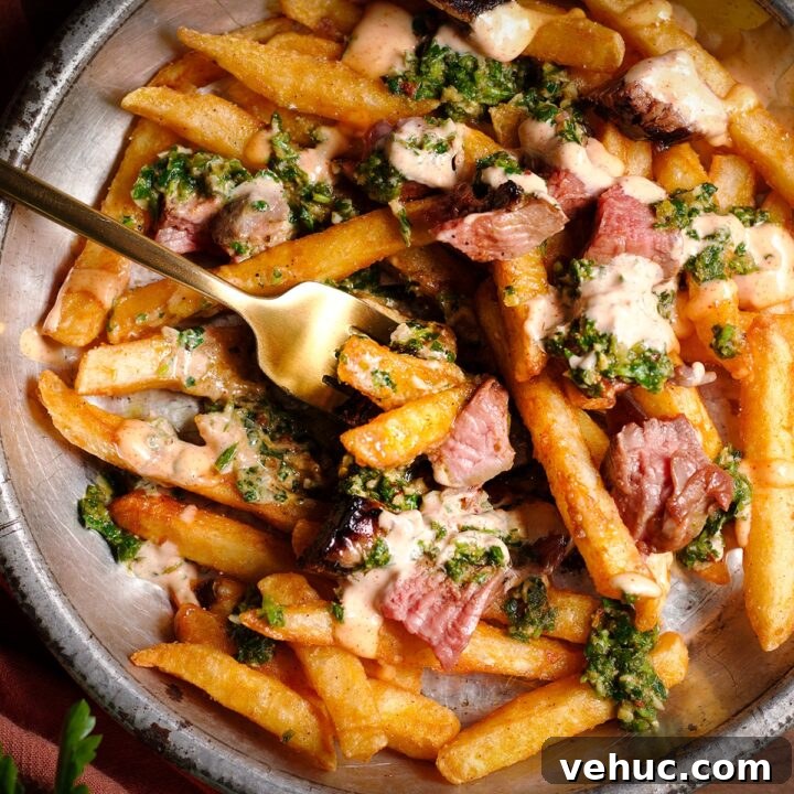 Using a fork to take a bite of chimichurri steak fries.