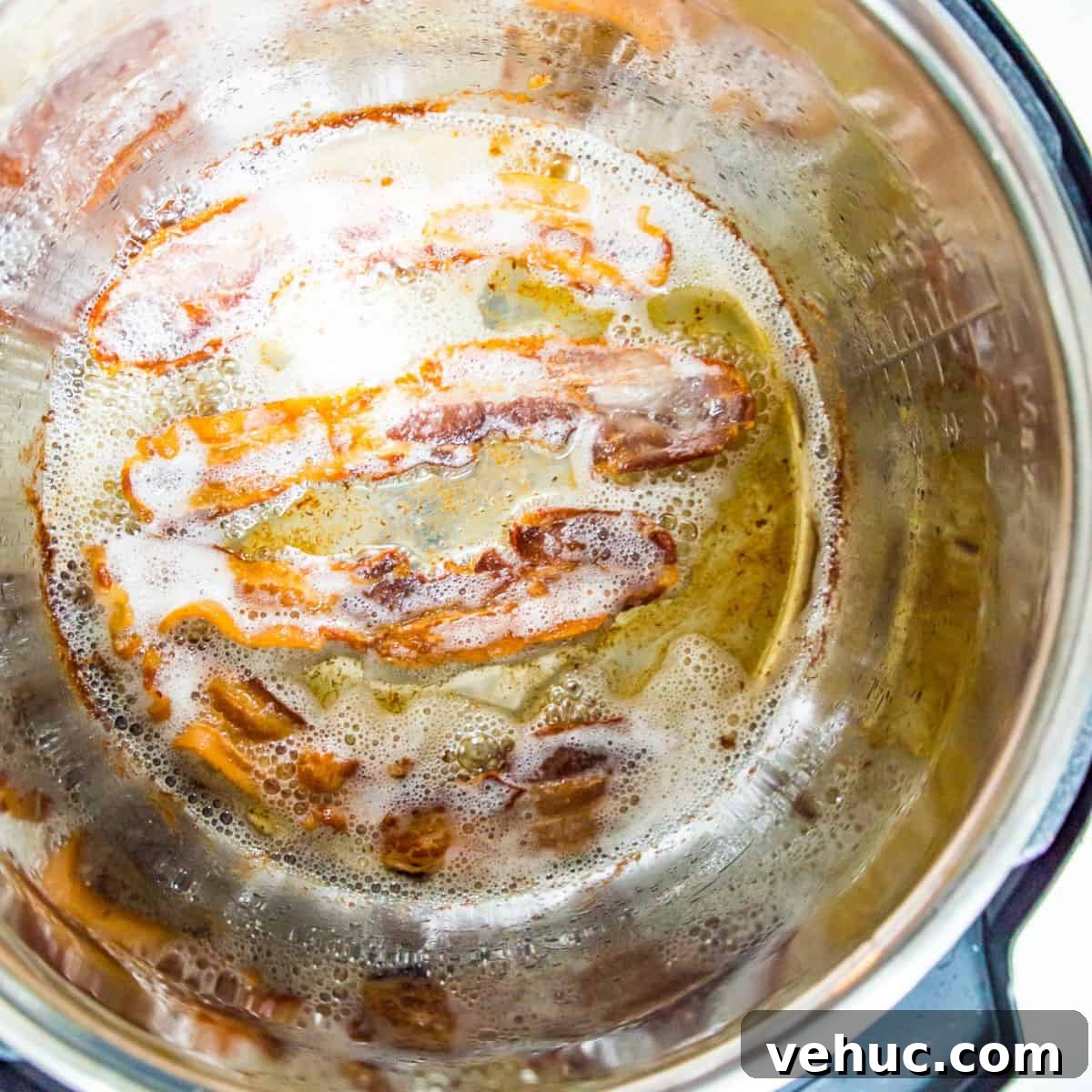 Crispy Instant Pot Bacon in Minutes: Tender, Savory Results 4 An Instant Pot with bacon cooking in it.