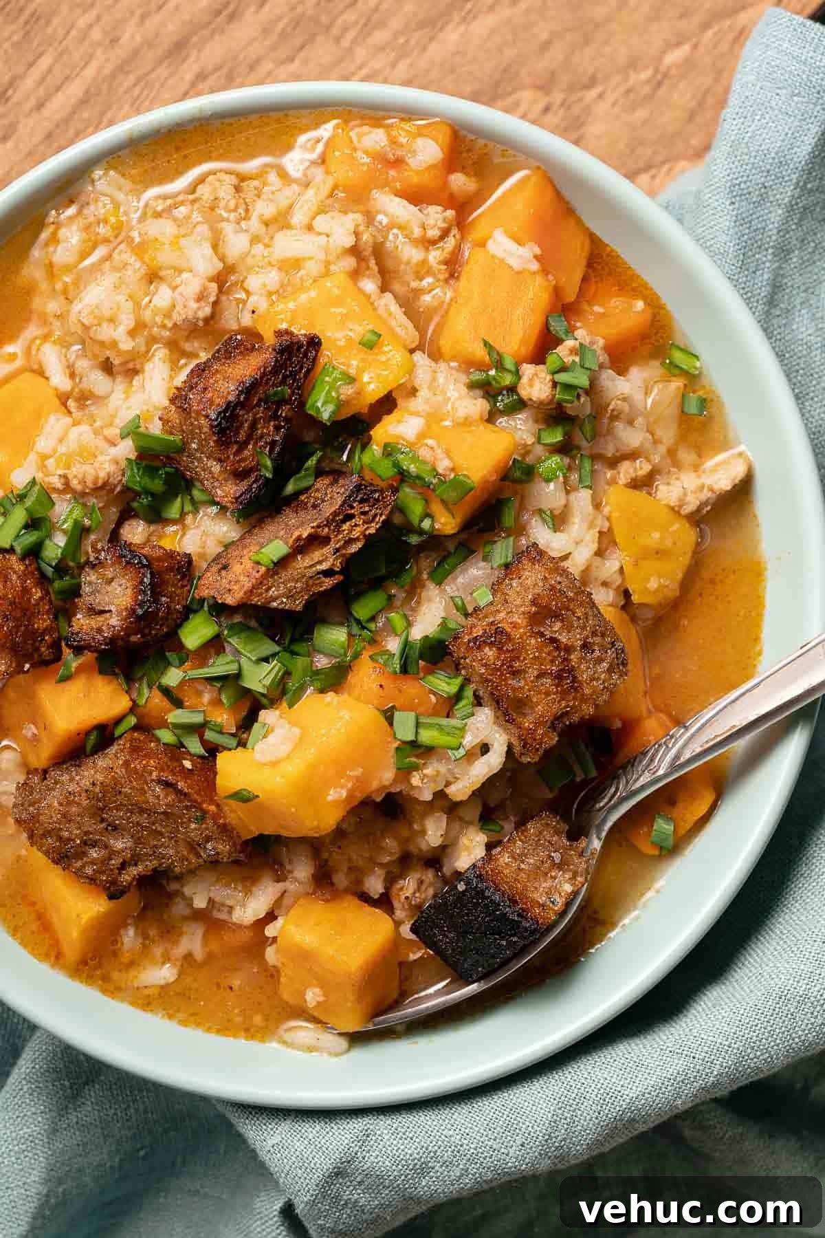 Roasted Turkey and Sweet Potato Soup Recipe 2 bowl of soup with spoon and napkin on the side