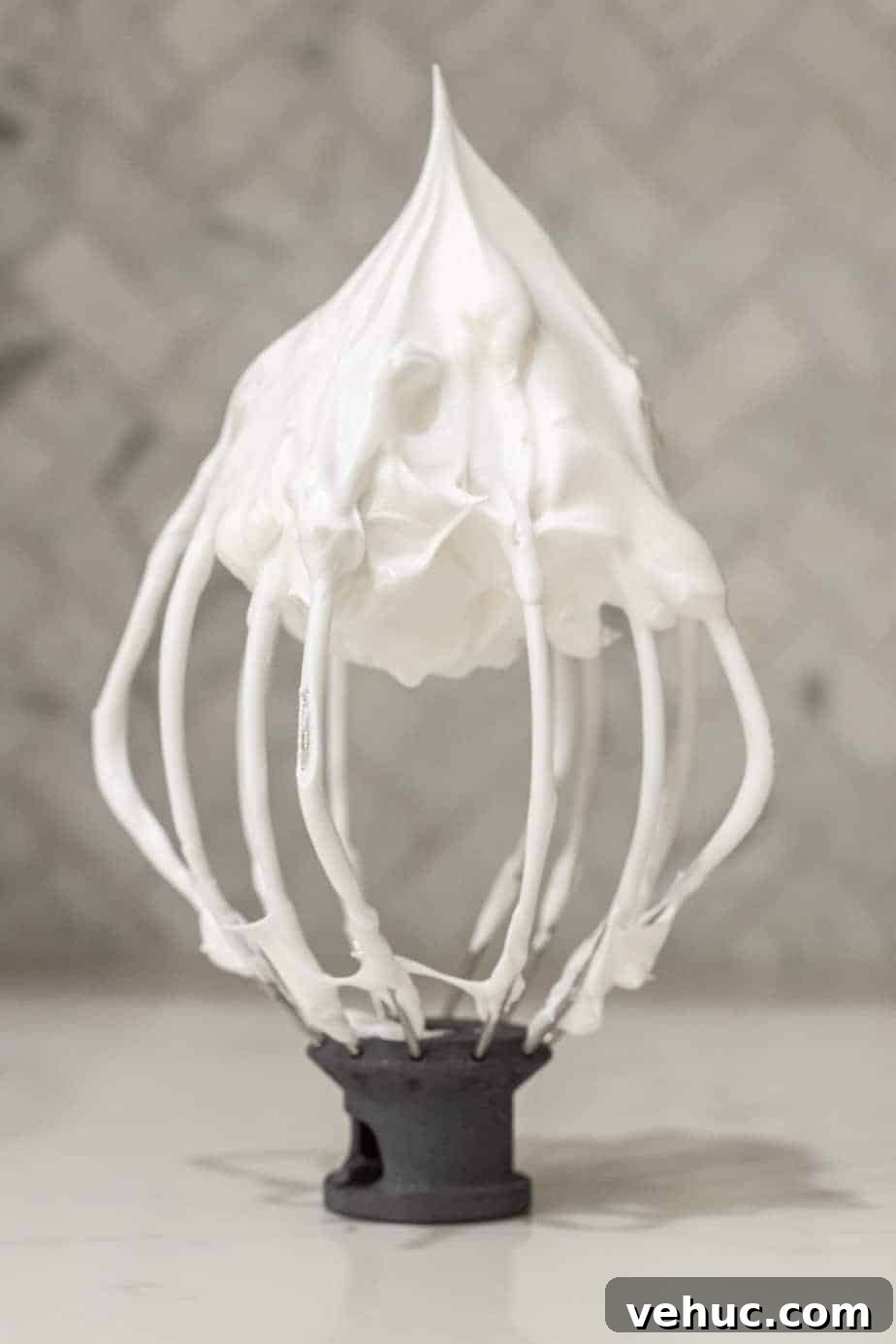 Decadent Chocolate Mocha Cake Recipe with Espresso Frosting 5 stand mixer whisk with white meringue on whisk