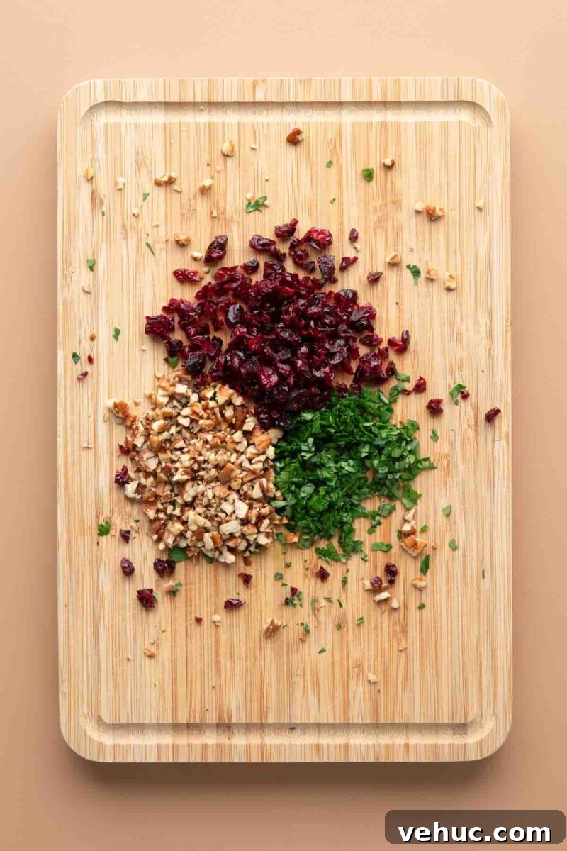 Candied Pecan Cranberry Goat Cheese Bites for Holiday Appetizers 5 chopped pecans, dried cranberries, and fresh parsley
