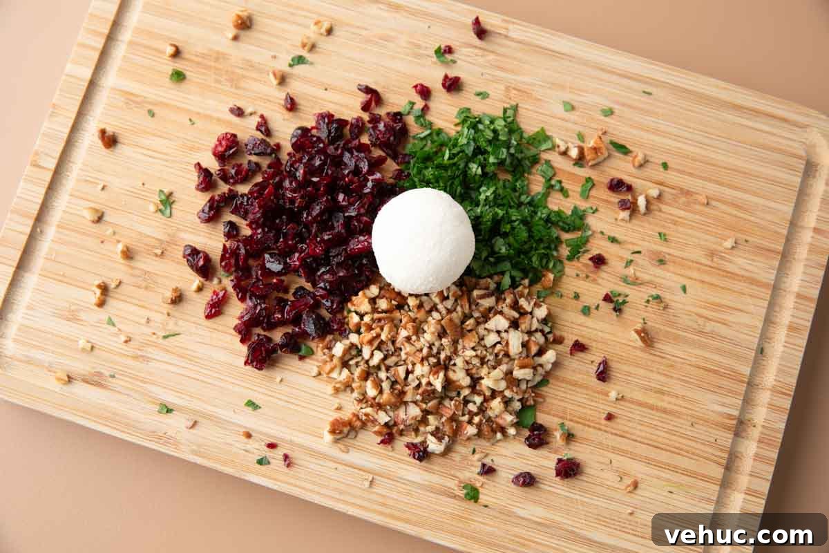 Candied Pecan Cranberry Goat Cheese Bites for Holiday Appetizers 6 rolling goat cheese ball in cranberries, parsley, and candied pecans