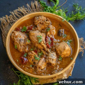 Mughlai Chicken Stew Recipe: Aromatic Creamy Indian-Style Stew 16 A bowl of spicy Mughlai Chicken Stew garnished with fresh cilantro.