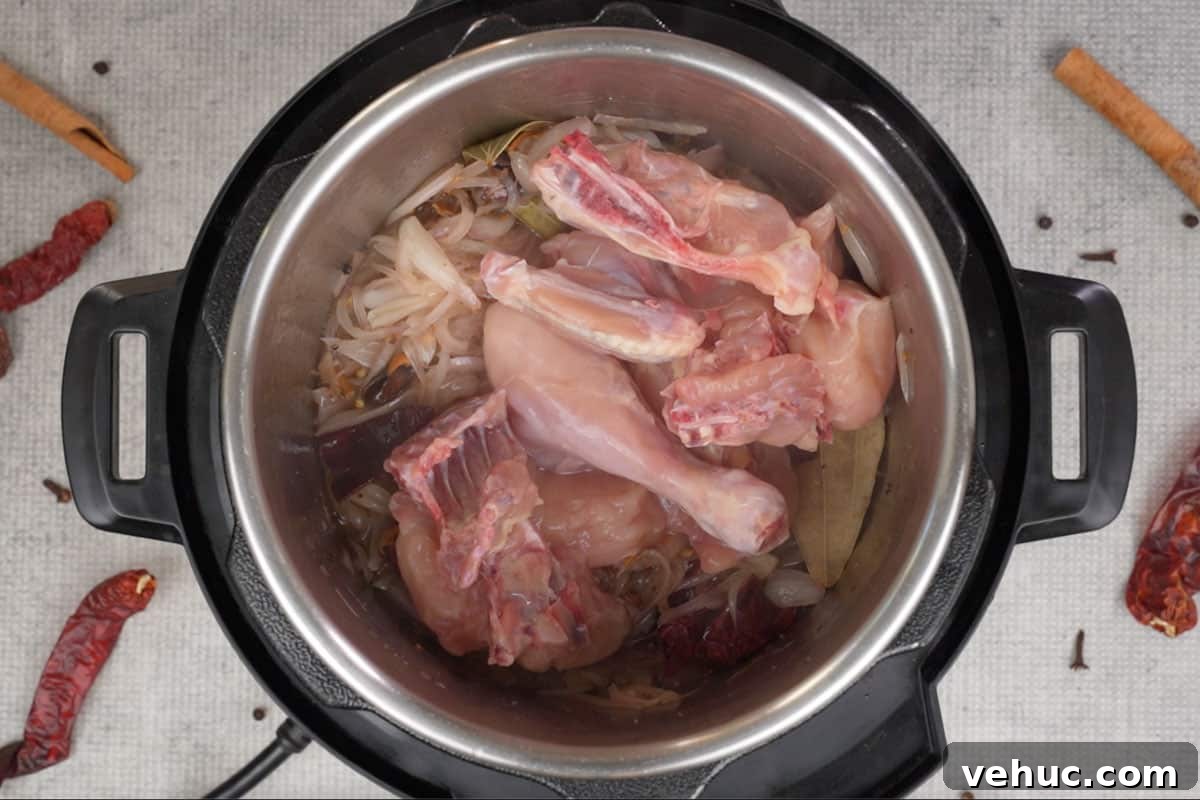Mughlai Chicken Stew Recipe: Aromatic Creamy Indian-Style Stew 7 Chicken added to the pot.
