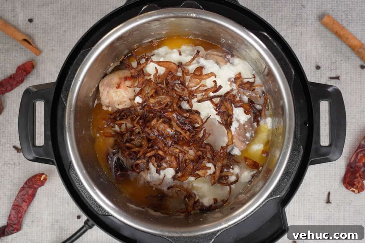 Mughlai Chicken Stew Recipe: Aromatic Creamy Indian-Style Stew 8 Yogurt, salt, crispy fried onions and water added to the pot.