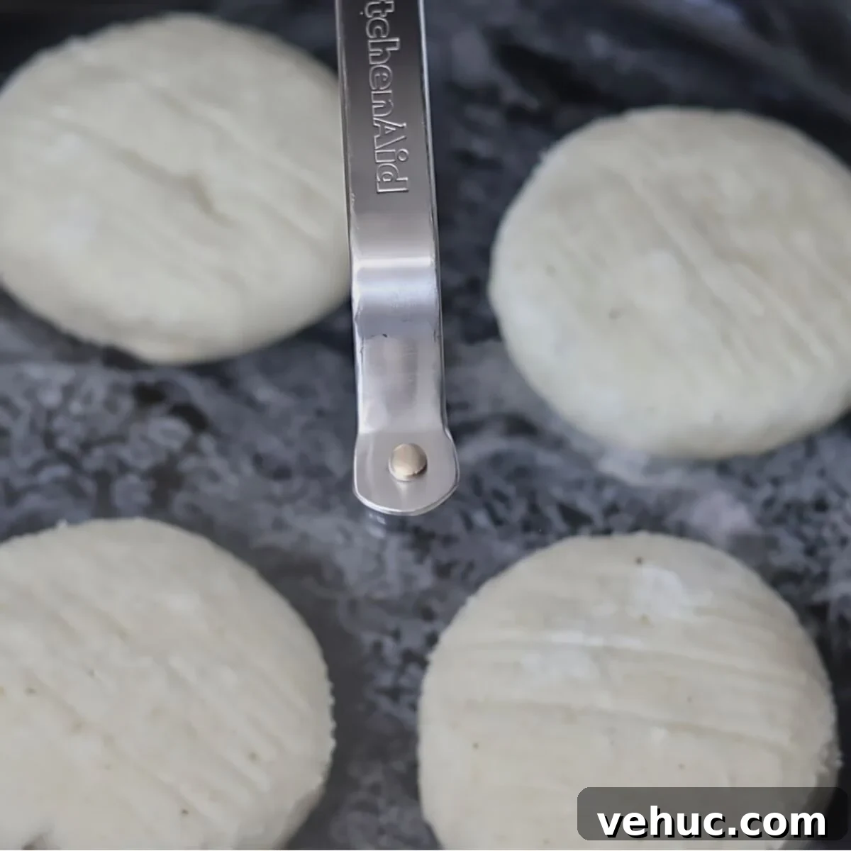 Gluten-Free Sourdough English Muffins Recipe You’ll Love 13 four rolls in cast iron skillet covered with glass lid.