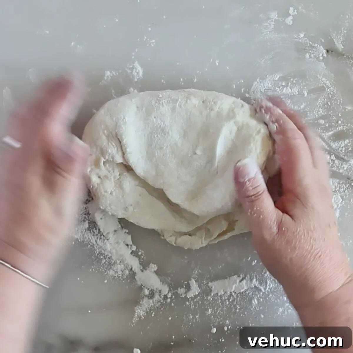 Gluten-Free Sourdough English Muffins Recipe You’ll Love 5 kneading dough on floured marble surface.