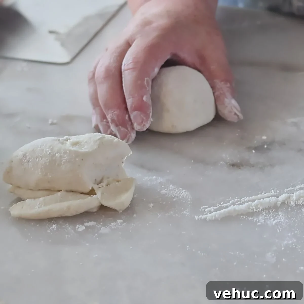 Gluten-Free Sourdough English Muffins Recipe You’ll Love 7 shaping rolls into rounds on marble surface.