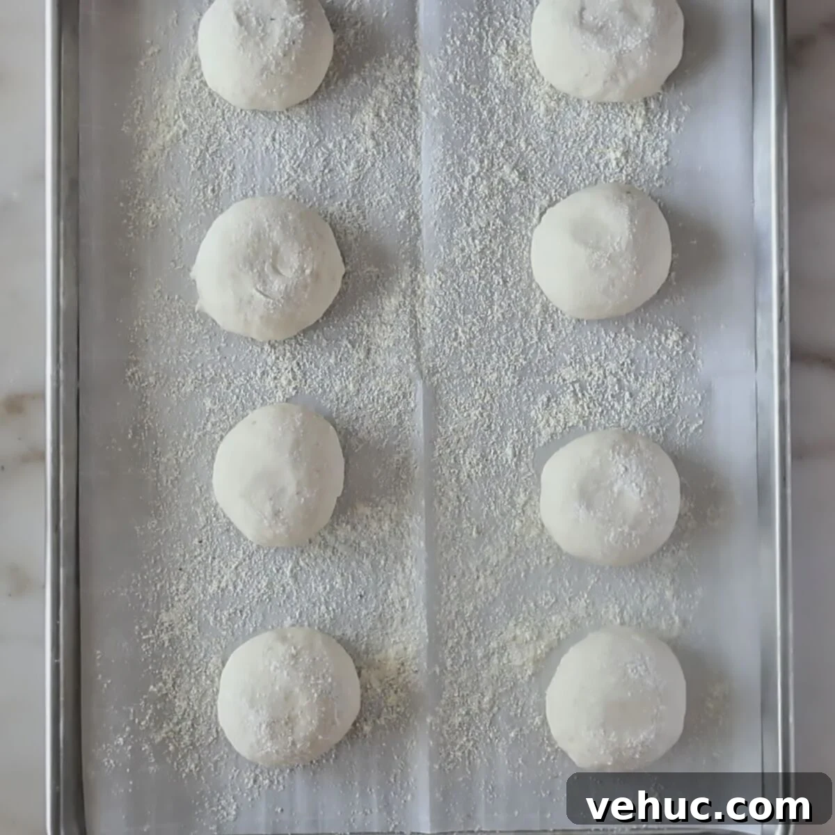 Gluten-Free Sourdough English Muffins Recipe You’ll Love 8 round rolls on parchment-lined cornmeal sheet pan.