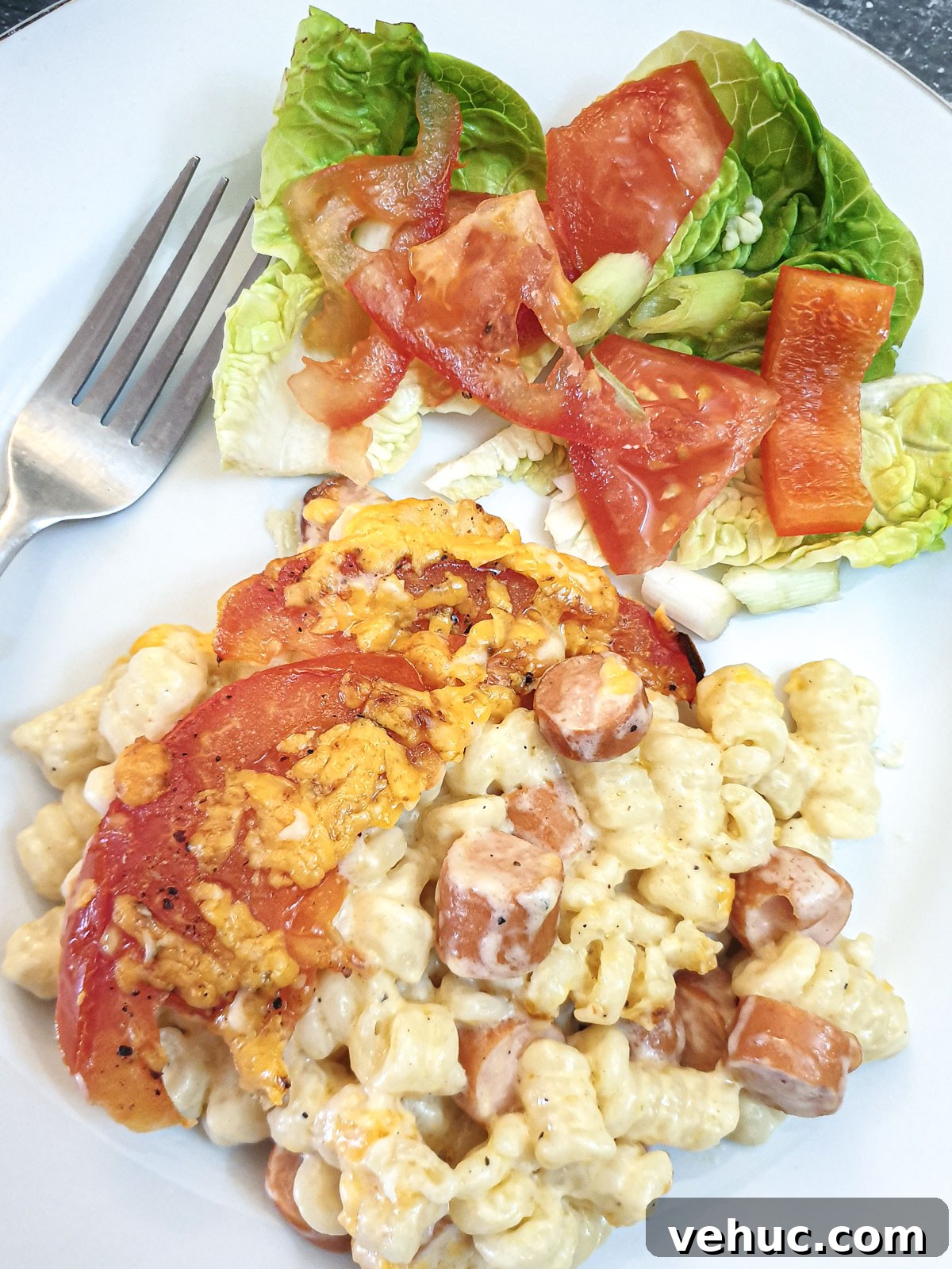 Ultimate Creamy Macaroni & Cheese Recipe for Comfort Night 3 A plate of macaroni cheese deluxe with a helping of green salad.