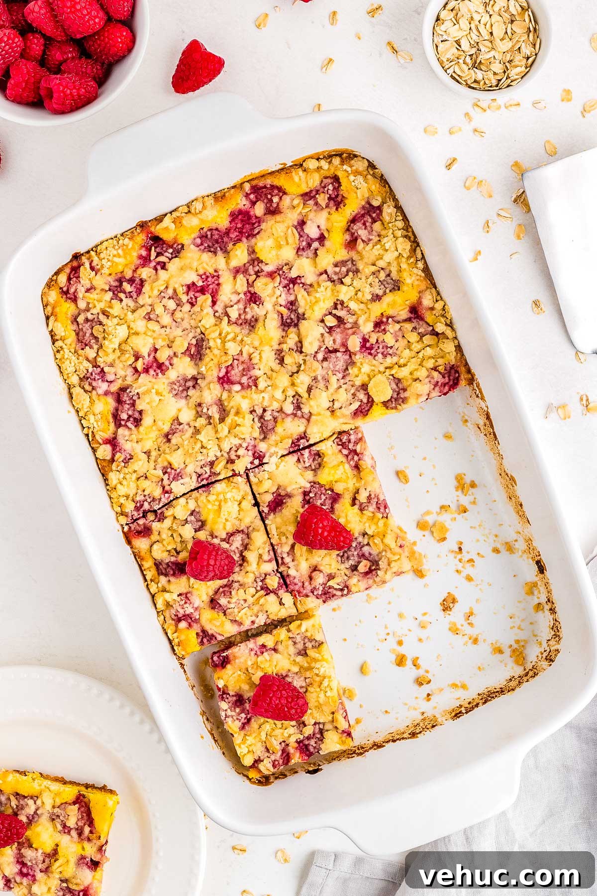 Chewy Raspberry Oat Bars with Homemade Jam Filling 9 The finished raspberry oat bars in the baking pan and cut into squares.