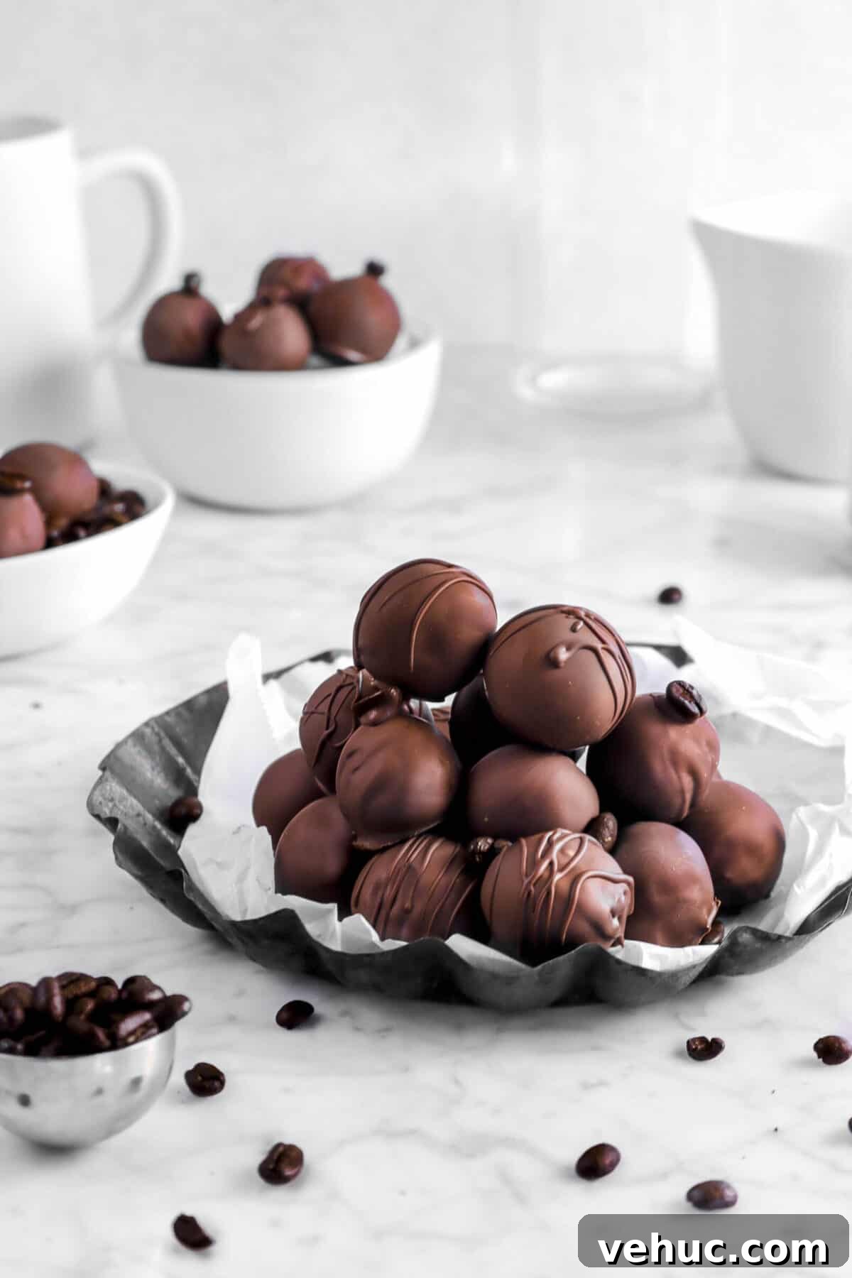 Top 21 Most-Loved Recipes of 2021: Trending Dishes You’ll Want to Try 15 stacked coffee truffles on lined pan with coffee beans and more truffles behind