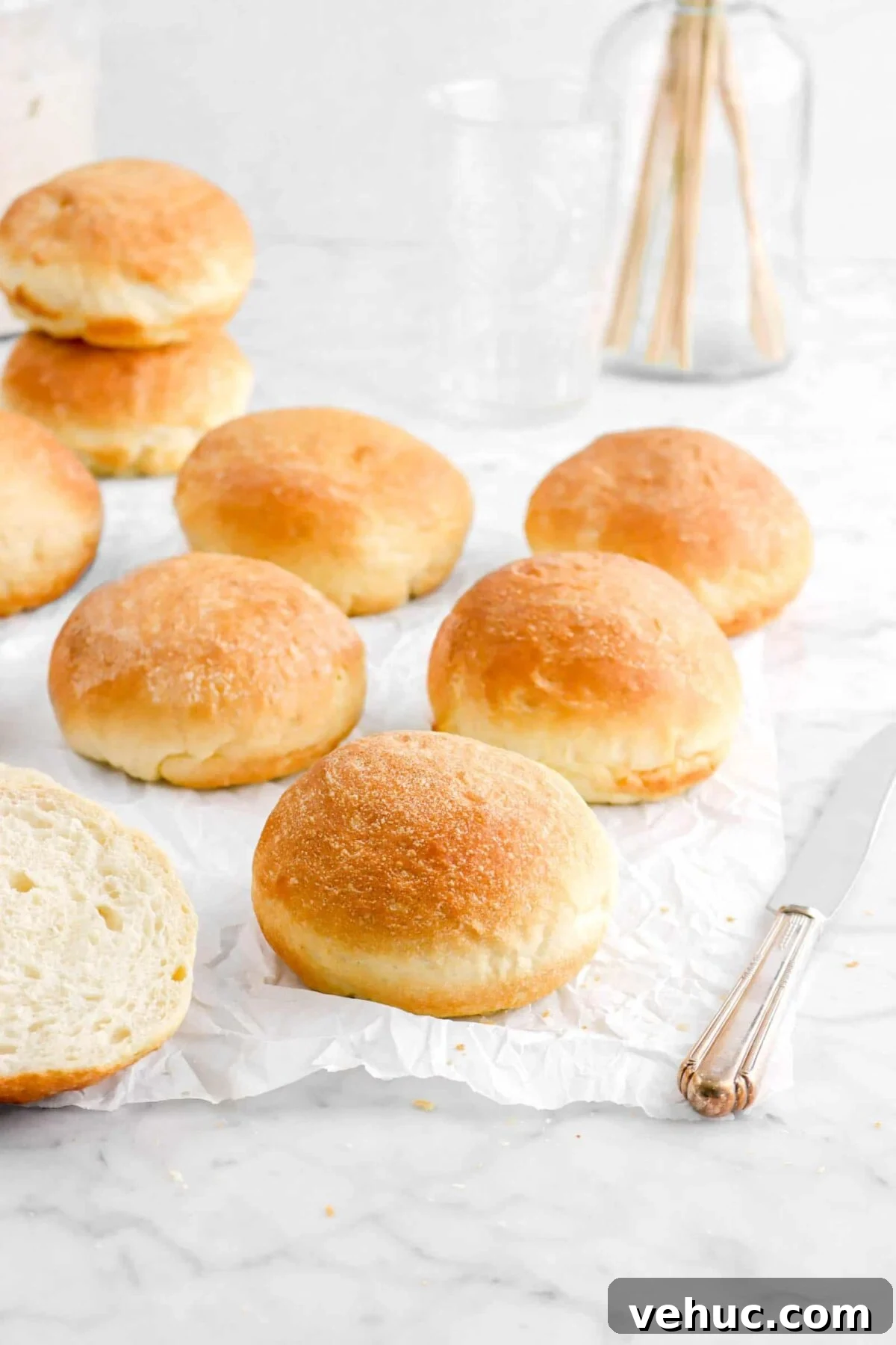 Top 21 Most-Loved Recipes of 2021: Trending Dishes You’ll Want to Try 20 six hamburger buns on parchment paper with two stacked behind and a knife