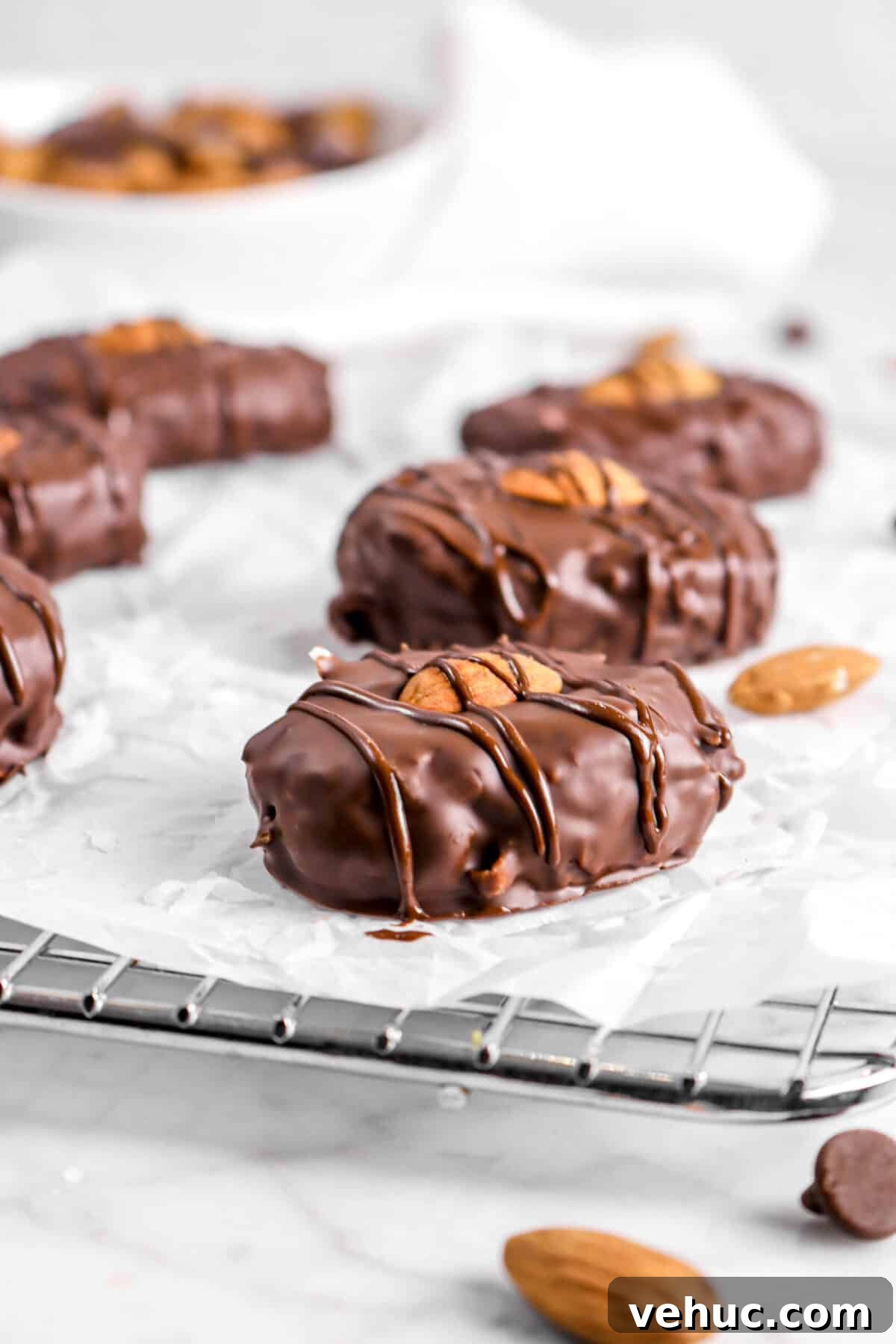 Top 21 Most-Loved Recipes of 2021: Trending Dishes You’ll Want to Try 3 almond joys on parchment with almonds and chocolate chips