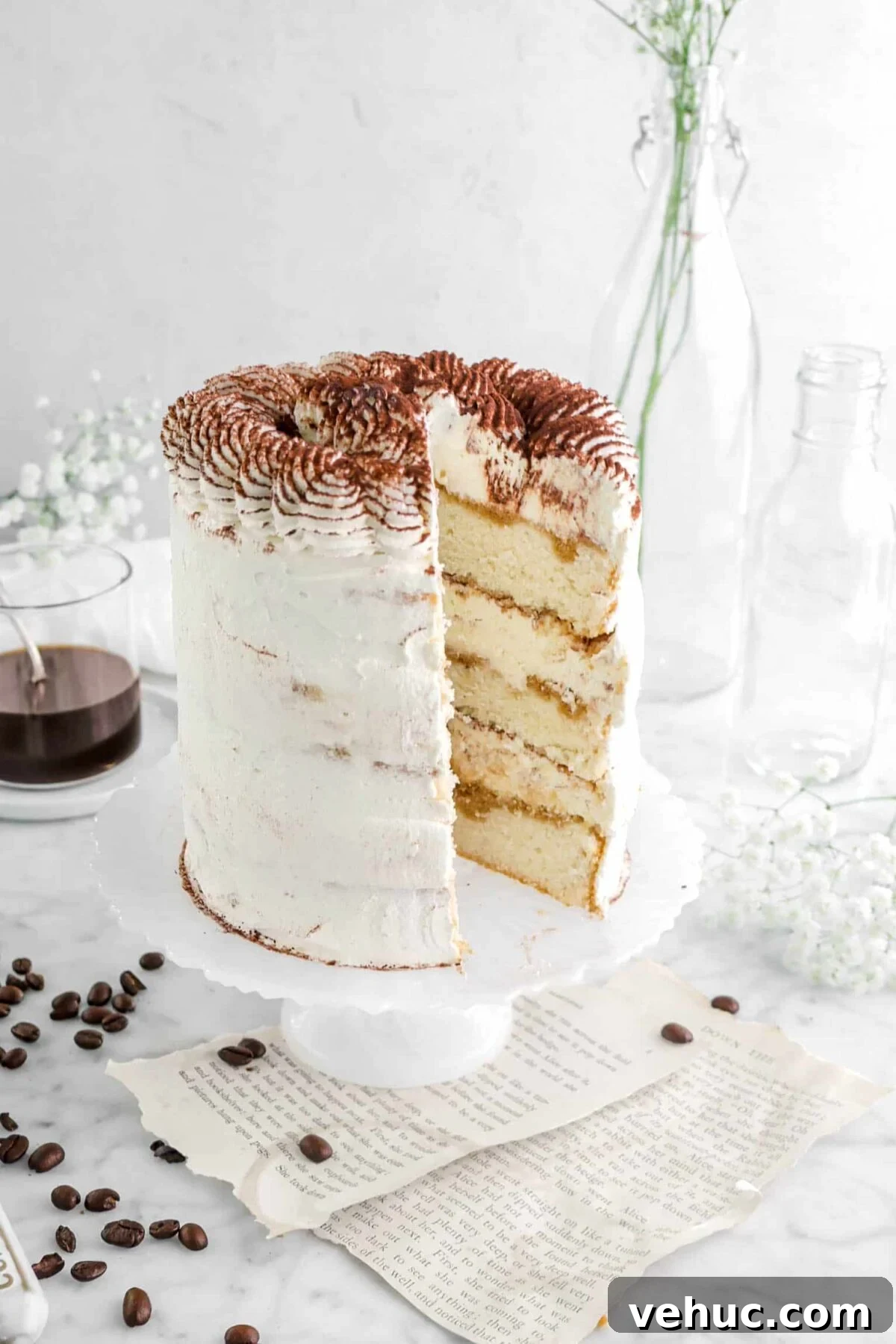 Top 21 Most-Loved Recipes of 2021: Trending Dishes You’ll Want to Try 8 close up of cake with slice missing out of it on white cake stand