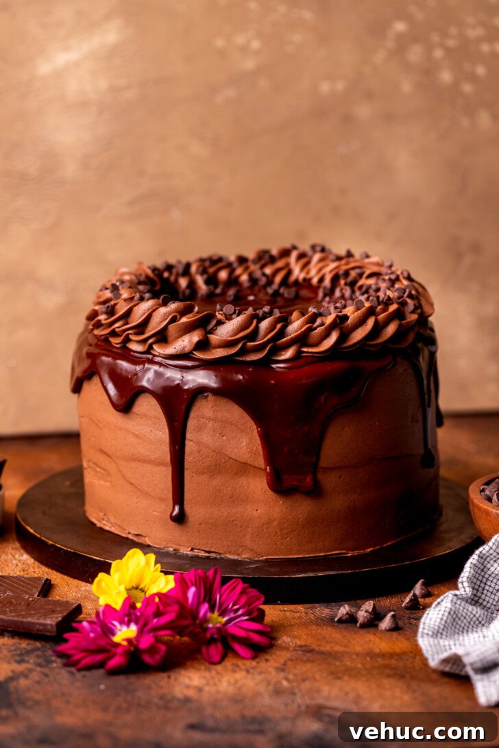 Silky Chocolate Cream Cheese Frosting Recipe for Cakes & Cupcakes 7 Decorated cake on a wood board.