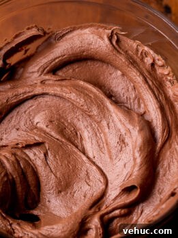 Silky Chocolate Cream Cheese Frosting Recipe for Cakes & Cupcakes 8 Side view of chocolate cream cheese frosting.
