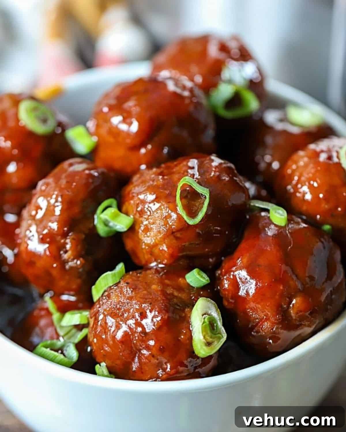 27 Festive Christmas Finger Food Appetizers for Holiday Parties 7 Bowl full of grape jelly chili sauce meatballs.