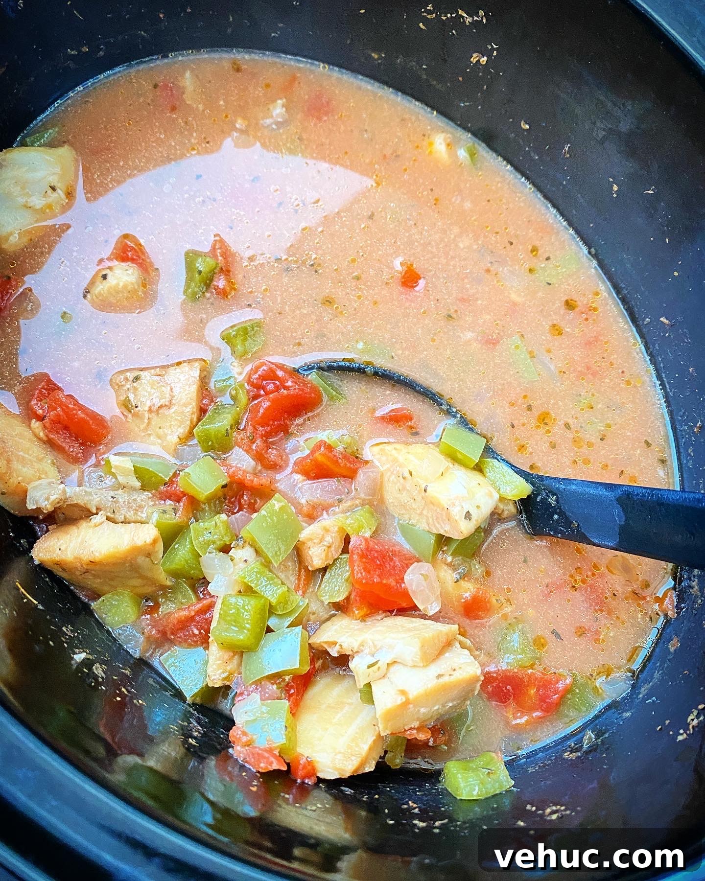 Mediterranean Slow-Cooker Fish Stew with Video Tutorial 5 overhead shot of cooked Slow Cooker Mediterranean Fish Stew in a black slow cooker
