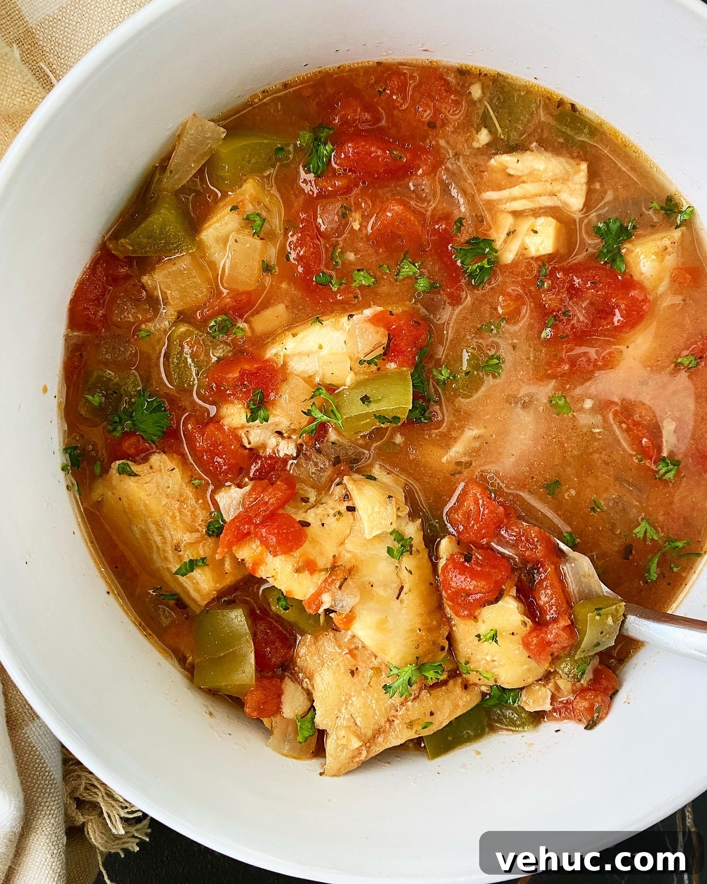 Mediterranean Slow-Cooker Fish Stew with Video Tutorial 6 overhead shot of Slow Cooker Mediterranean Fish Stew in a white bowl