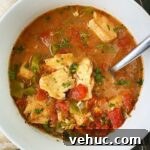 overhead shot of Slow Cooker Mediterranean Fish Stew in a white bowl