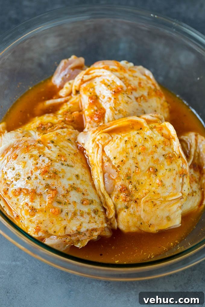 Chicken in marinade A bowl of chicken pieces coated in marinade.