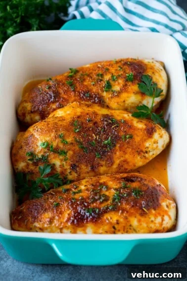 Crispy Oven-Baked Chicken Thighs with Garlic and Herbs 3 Baked chicken breast topped with fresh chopped parsley.