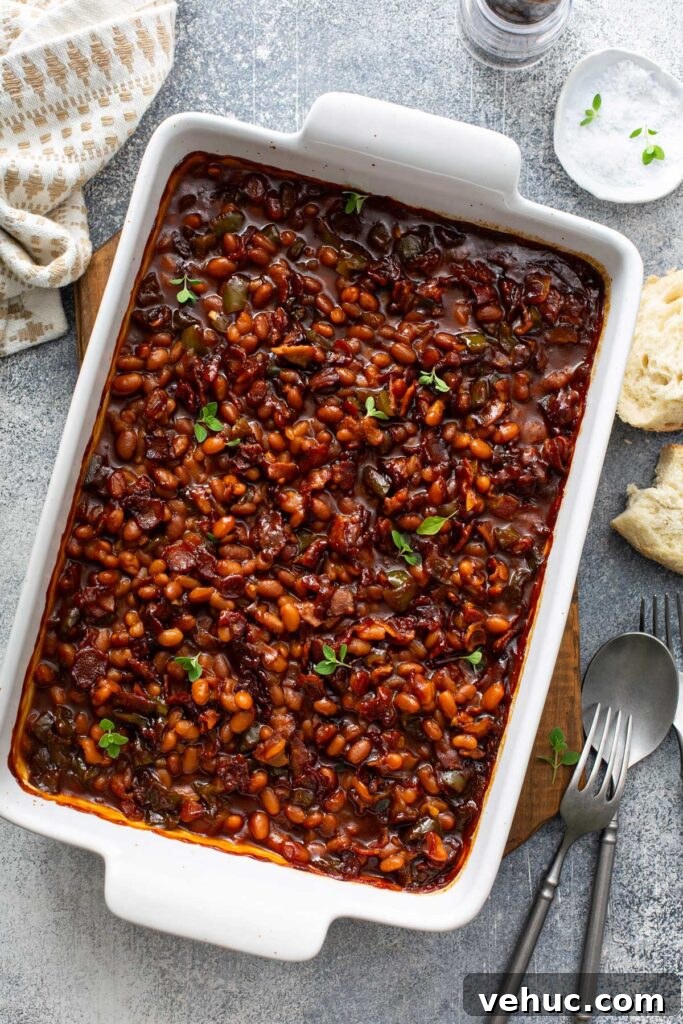 Classic Homemade Baked Beans Recipe for Flavorful Comfort Food 6 Beans with bacon in a baking dish.