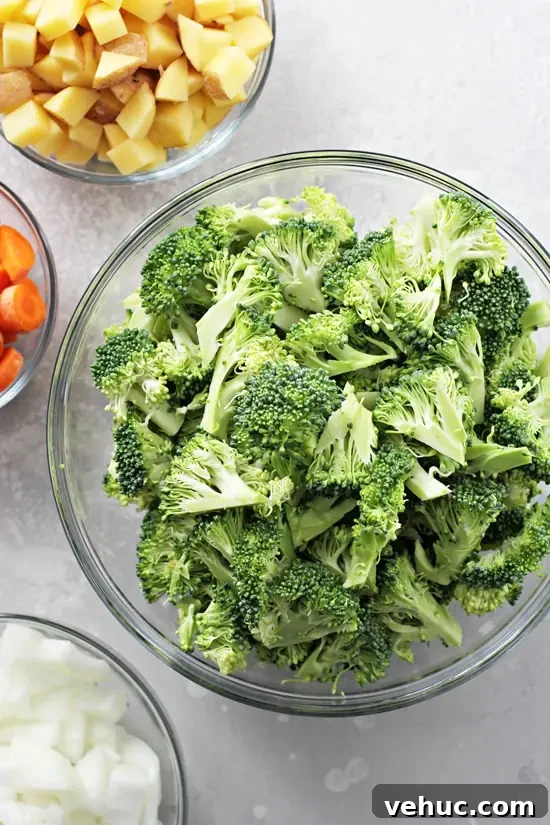 Creamy Dairy-Free Broccoli Soup Recipe for Smooth Flavor 3 Chopped vegetables in glass bowls.