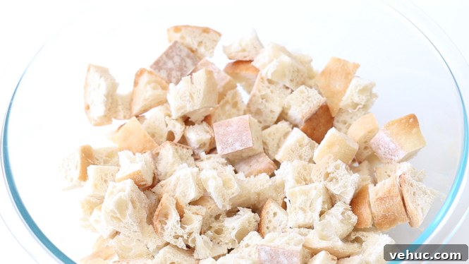 Savory Sausage and Herb Stuffing Recipe for Holiday Dinners 2 drying cubed bread out overnight in large clear bowl