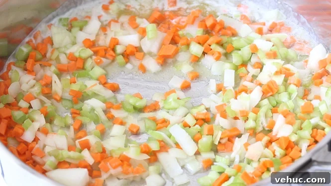 Savory Sausage and Herb Stuffing Recipe for Holiday Dinners 3 sautéing mirepoix in large skillet