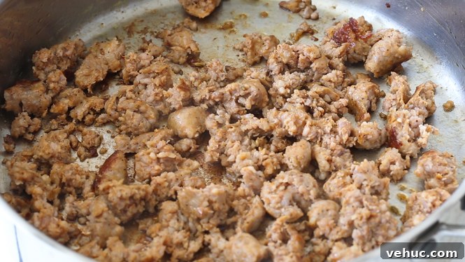 Savory Sausage and Herb Stuffing Recipe for Holiday Dinners 4 browning sausage in large skillet