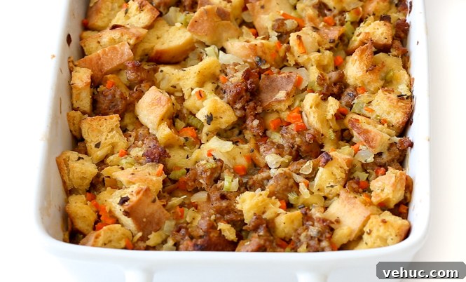 Savory Sausage and Herb Stuffing Recipe for Holiday Dinners 6 stuffing in white casserole dish cooling out of the oven