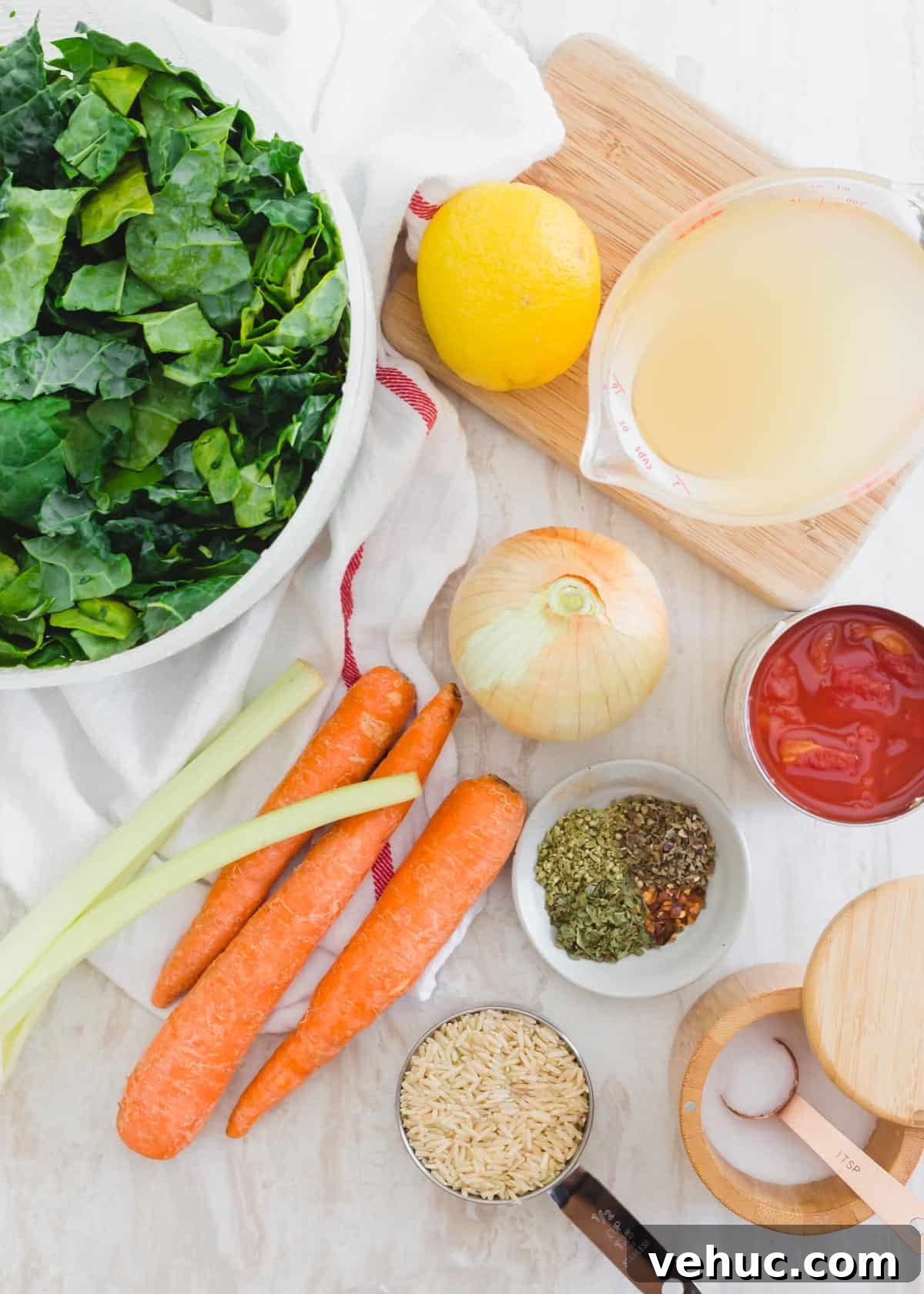 Ingredients to make Tuscan kale soup - Tuscan kale leaves, broth, diced tomatoes, yellow onion, celery, carrots, brown rice, herbs and spices. Ingredients to make Tuscan kale soup - Tuscan kale leaves, broth, diced tomatoes, yellow onion, celery, carrots, brown rice, herbs and spices.
