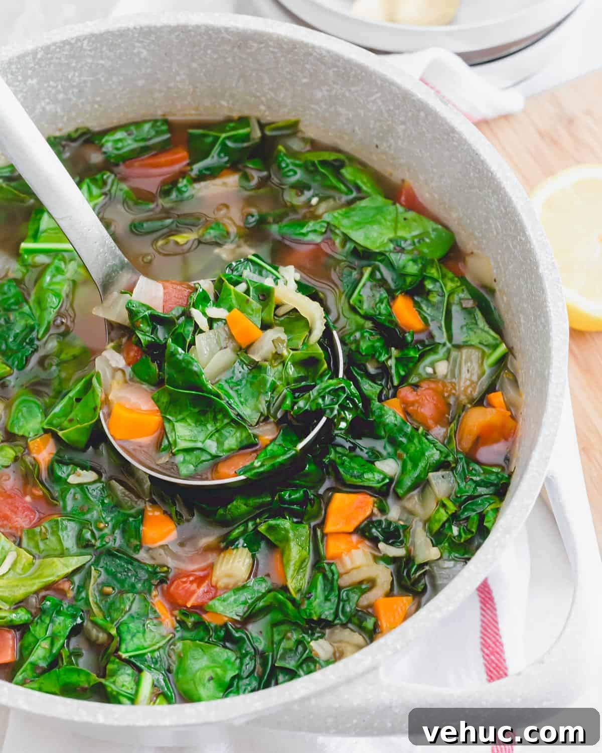 A pot of healthy vegetarian kale soup with brown rice. A pot of healthy vegetarian kale soup with brown rice.