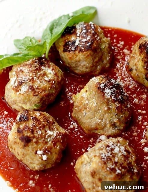 Turkey Zucchini Meatballs are made with fresh zucchini and lean ground turkey. The zucchini makes these meatballs super juicy and tender! turkey zucchini meatballs close